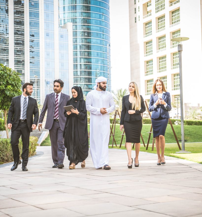 Multiethnic group of businesspeople meeting outdoors in a modern city